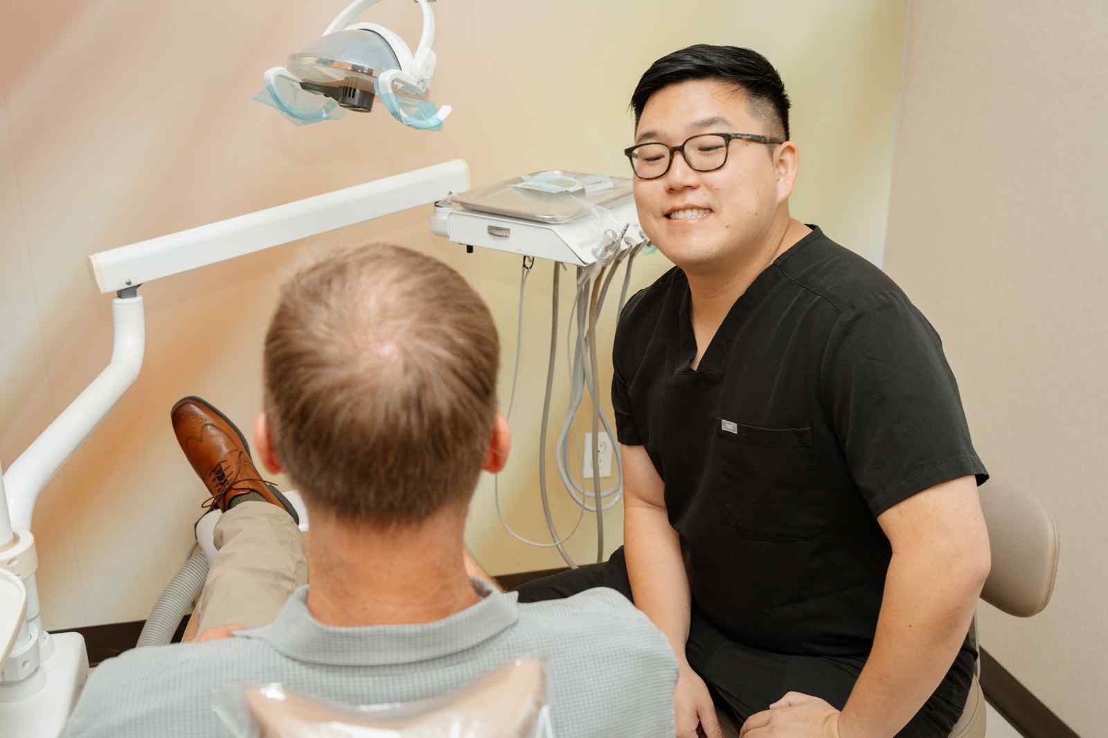 Dr. James Chon, DMD, with a patient at In Line Dentistry