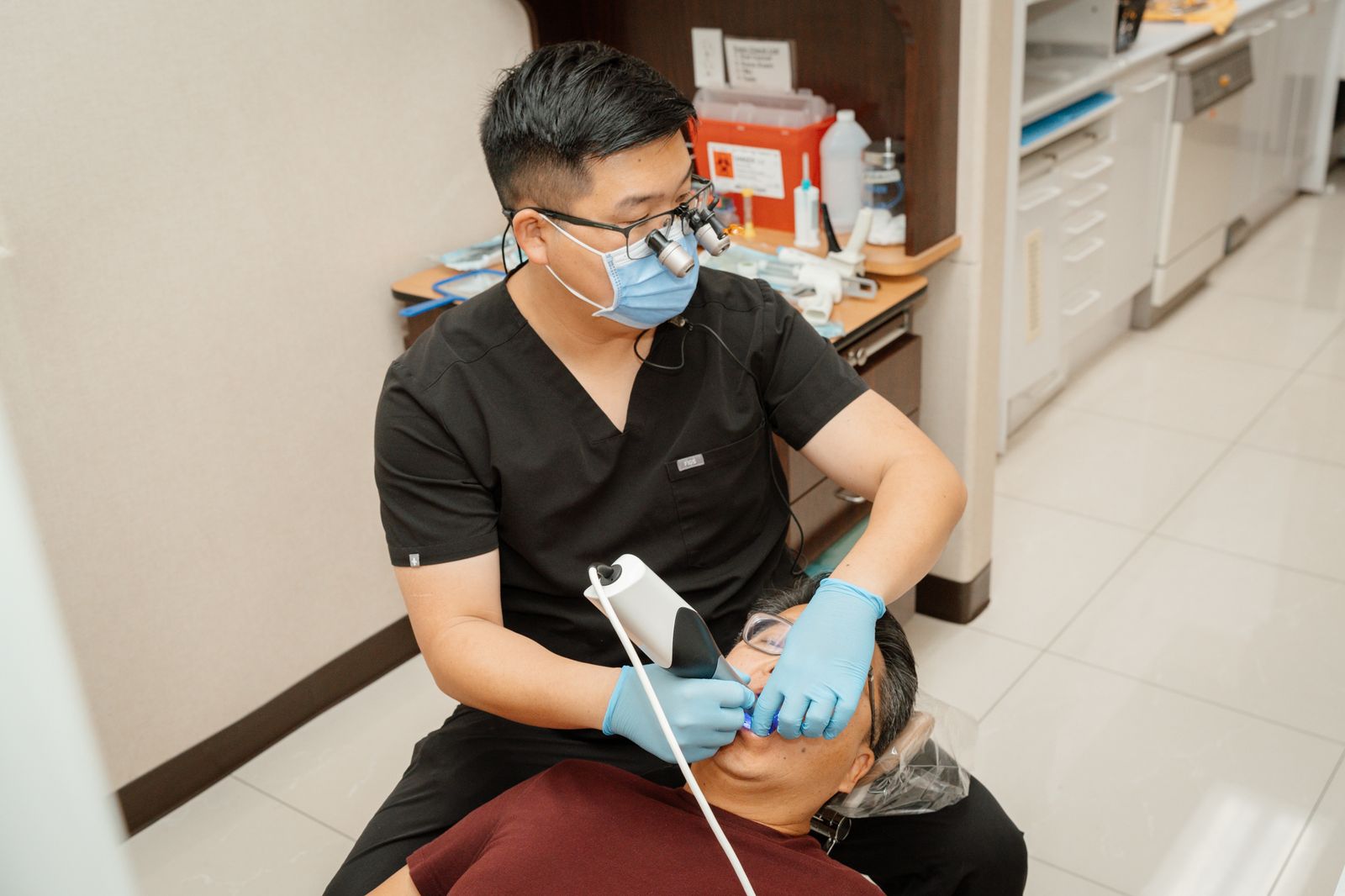 Dr. James Chon taking a digital scan of a patient's teeth