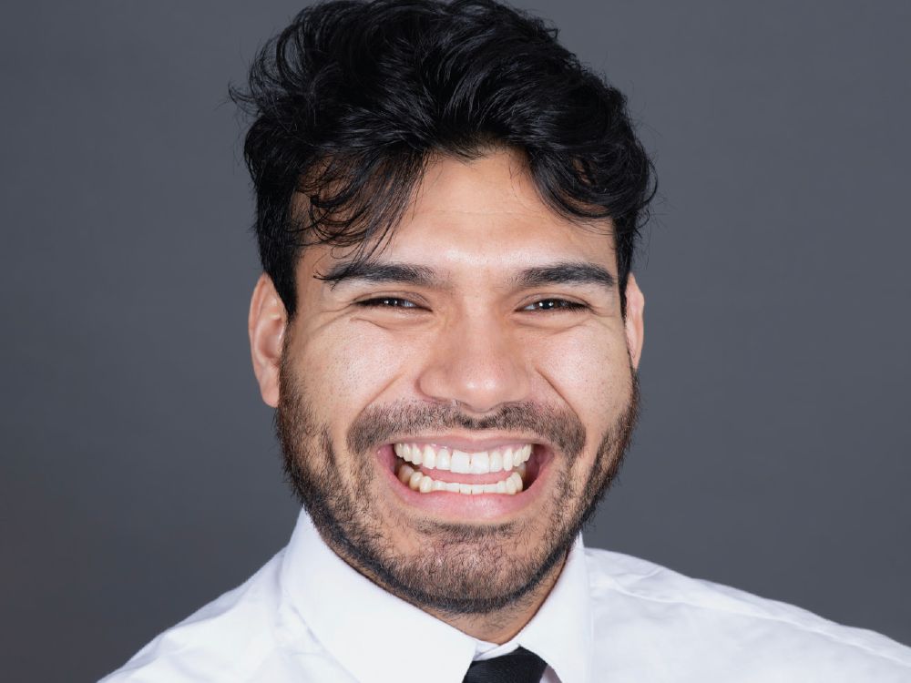 The restored smile in a full, natural laugh