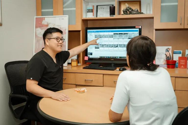 Dr. Chon going over X-rays with a patient