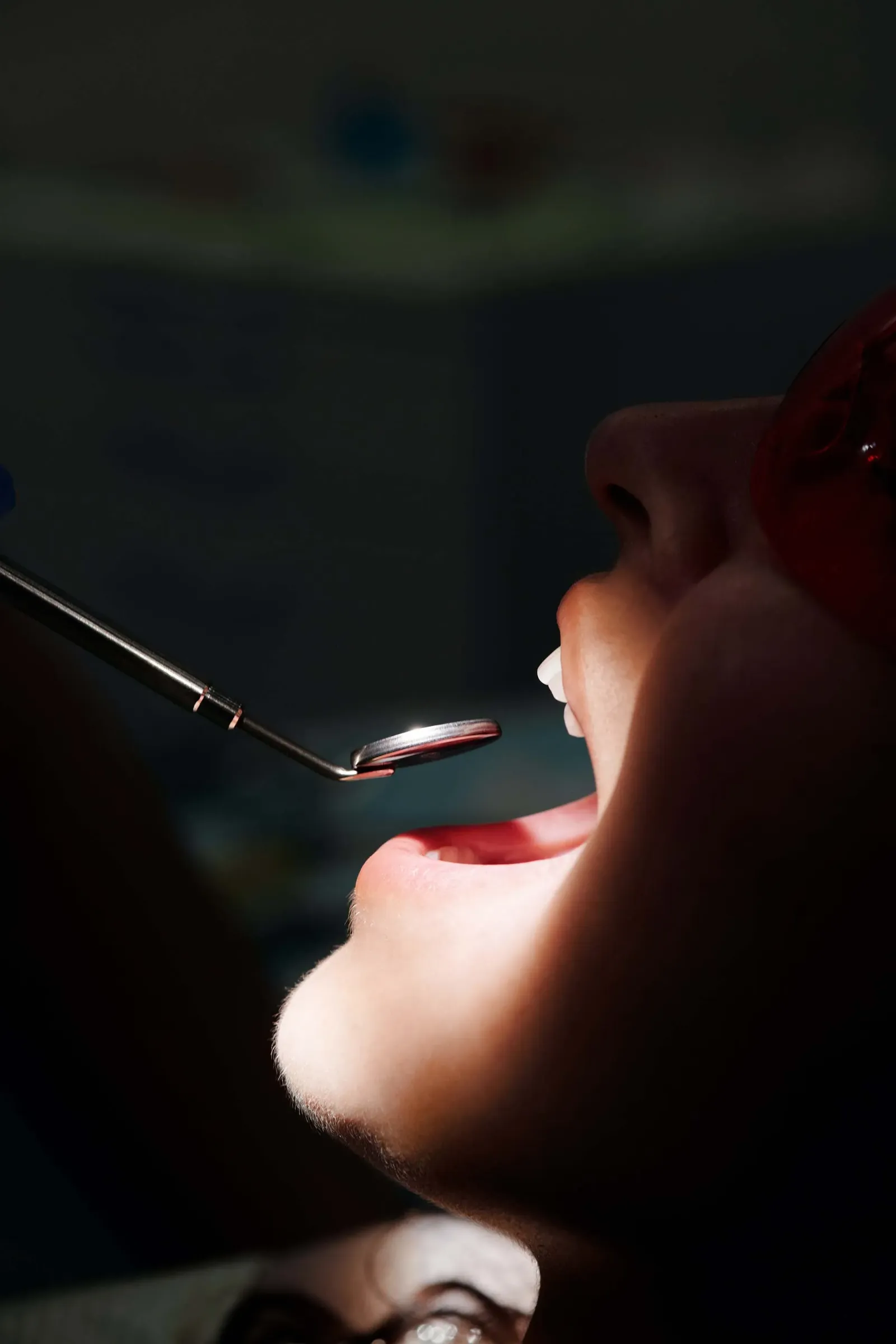 Dentist gently treating a patient